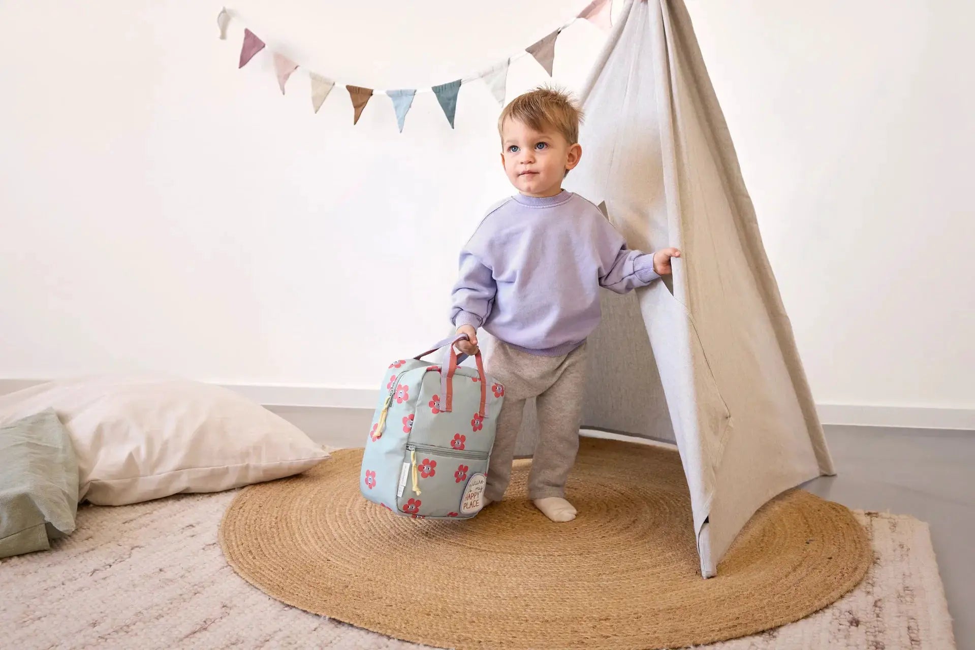 LÄSSIG mini square backpack with happy trails flower pattern by Citron Grenadine, light blue with pink flowers