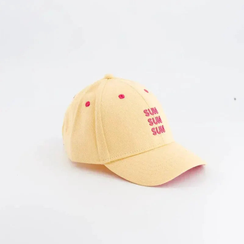 CHAMAYE baseball cap in pale yellow with pink SUN embroidery by Citron Grenadine.