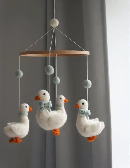GAMCHA mobile goose: felted baby mobile with three white geese, orange beaks, teal bows, wooden hoop