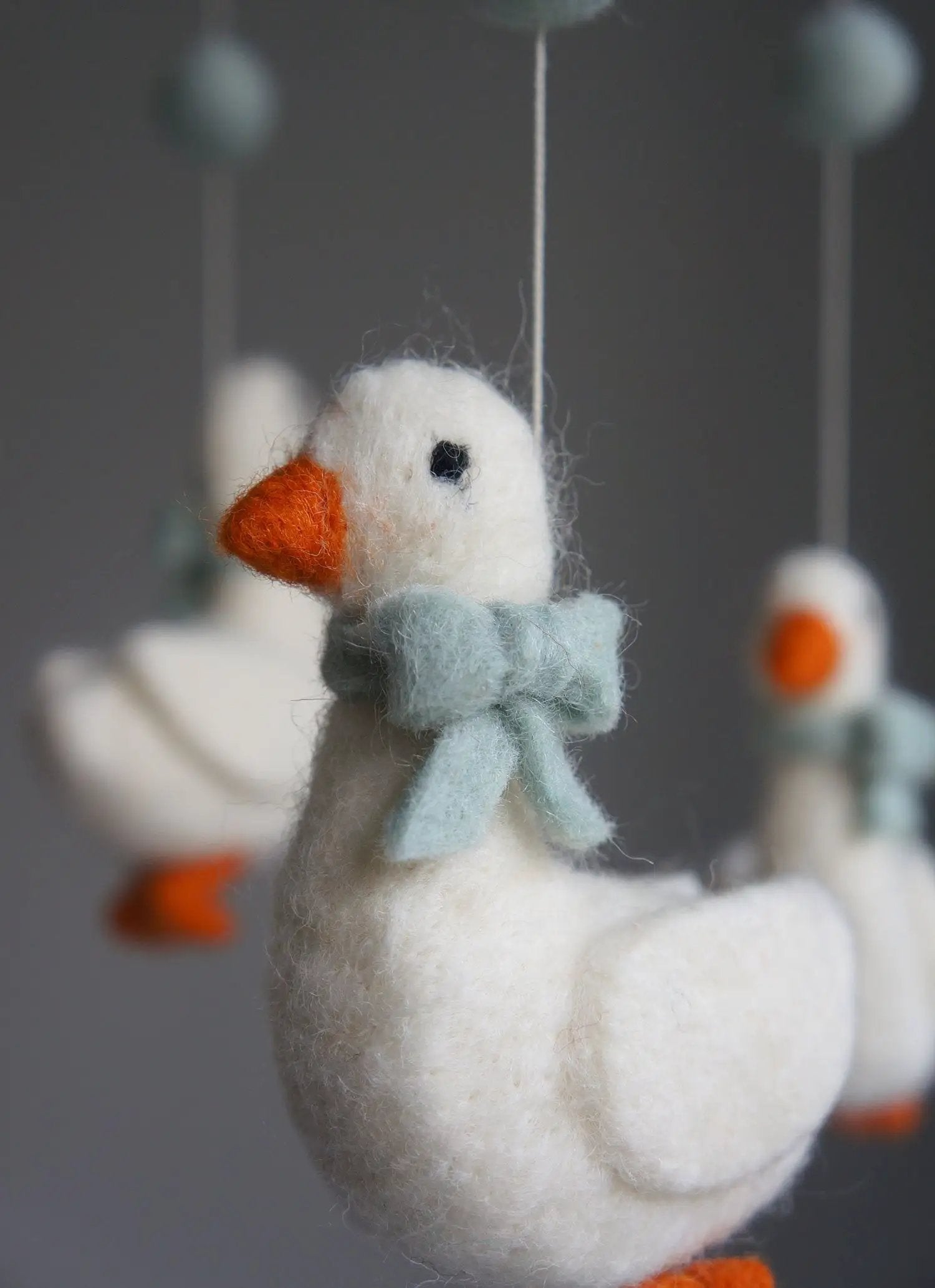 GAMCHA goose crib mobile by Citron Grenadine; white felt goose with orange beak and pale blue scarf