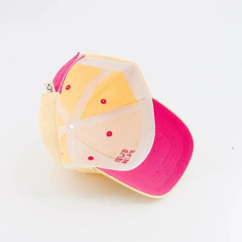 CHAMAYE baseball cap by Citron Grenadine; pink brim, yellow crown interior.