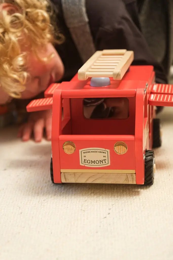Egmont Toys red wooden fire truck with ladder, 18m+ toy vehicle, front label EGMONT.