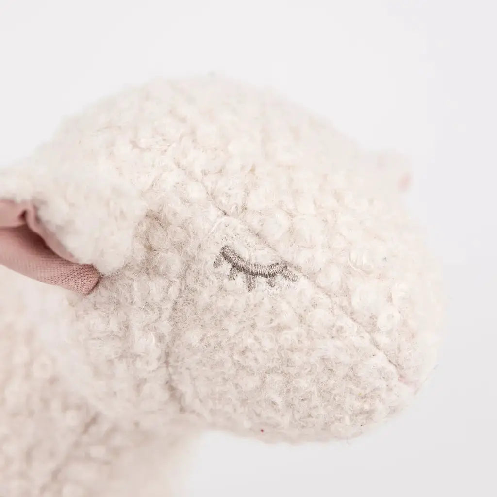 Mary the lamb pull toy, fluffy white plush with pink ear and embroidered closed eye