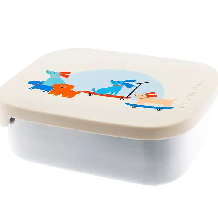 The Cotton Cloud lunchbox by Citron Grenadine; cream lid with a playful multicolor dog graphic, bread box.