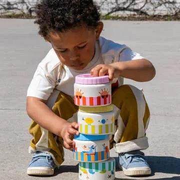 THE COTTON CLOUD inox 350ml lunch thermos set with colorful striped containers stacked by a child