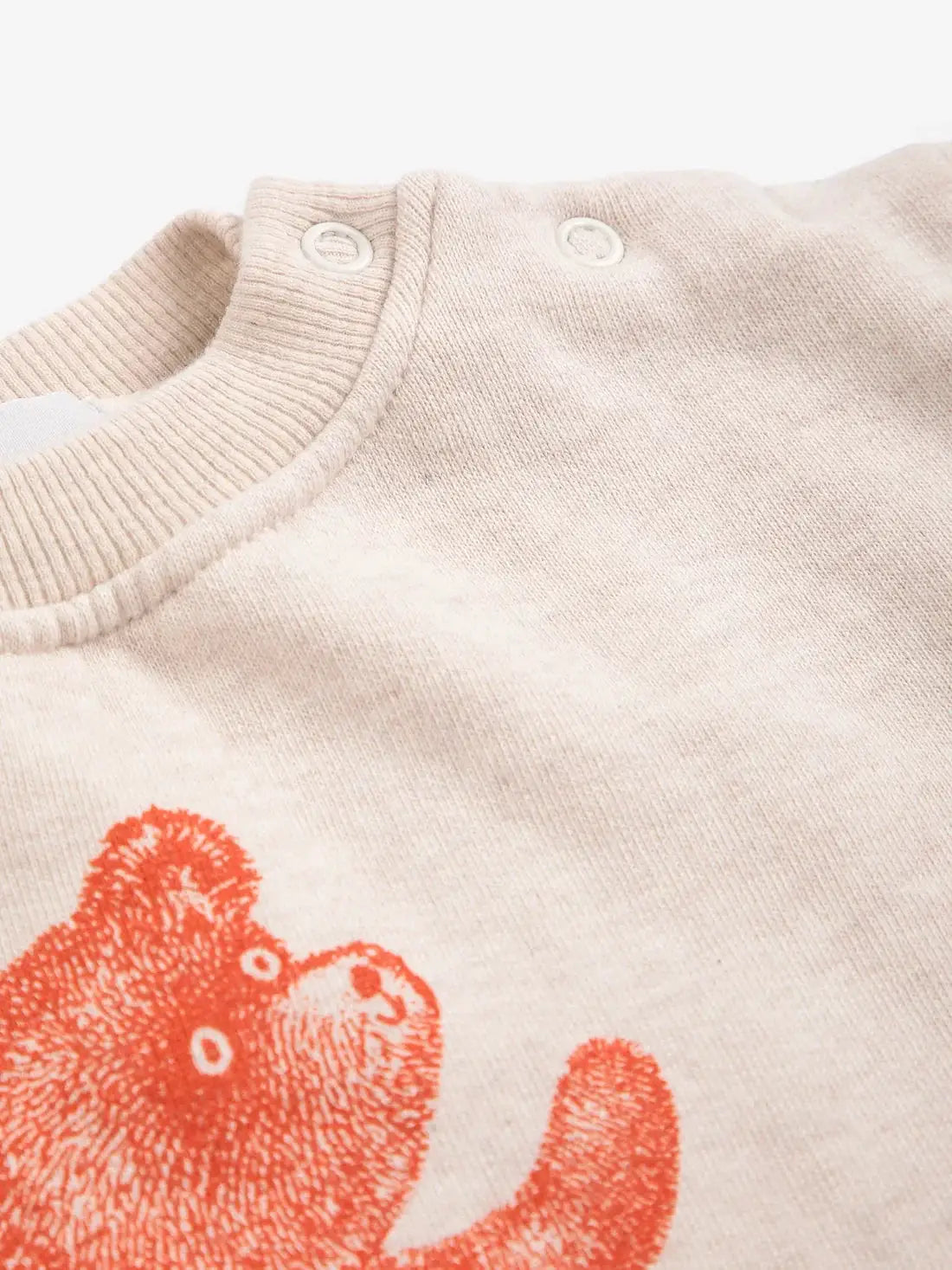 BOBO CHOSES softpaw monster sweatshirt, beige knit with red monster print and shoulder snap buttons