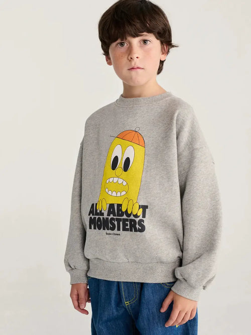 BOBO CHOSES bigtooth lemon sweatshirt, gray crewneck with yellow monster graphic and All About Monsters text