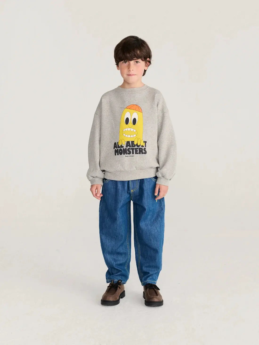 BOBO CHOSES bigtooth lemon sweatshirt in grey with a yellow cartoon monster graphic.