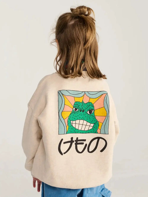 BOBO CHOSES beast sweatshirt; beige sweatshirt with colorful monster graphic on back