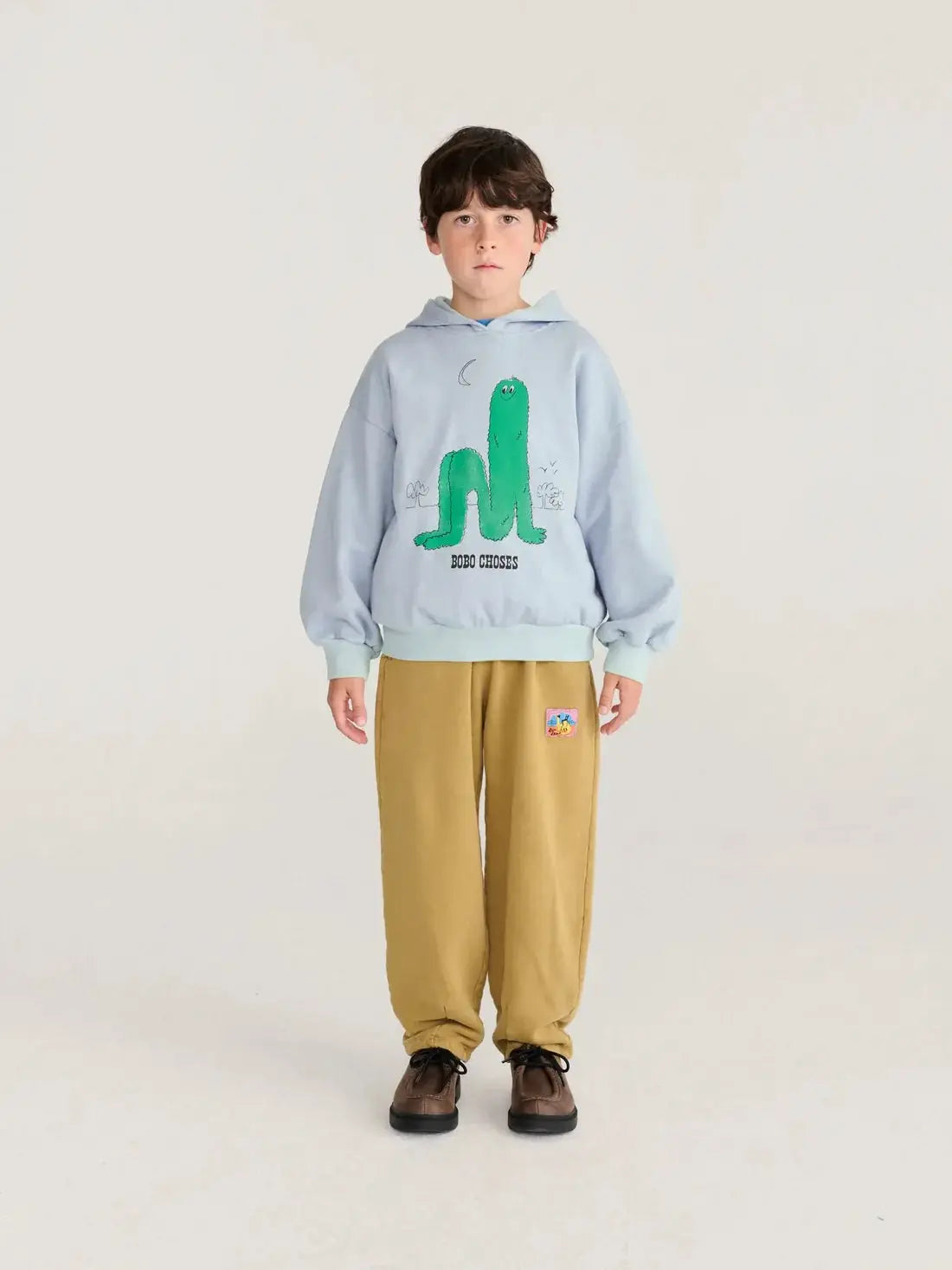 BOBO CHOSES long puff hoodie sweatshirt, light blue with a green graphic and ribbed cuffs.