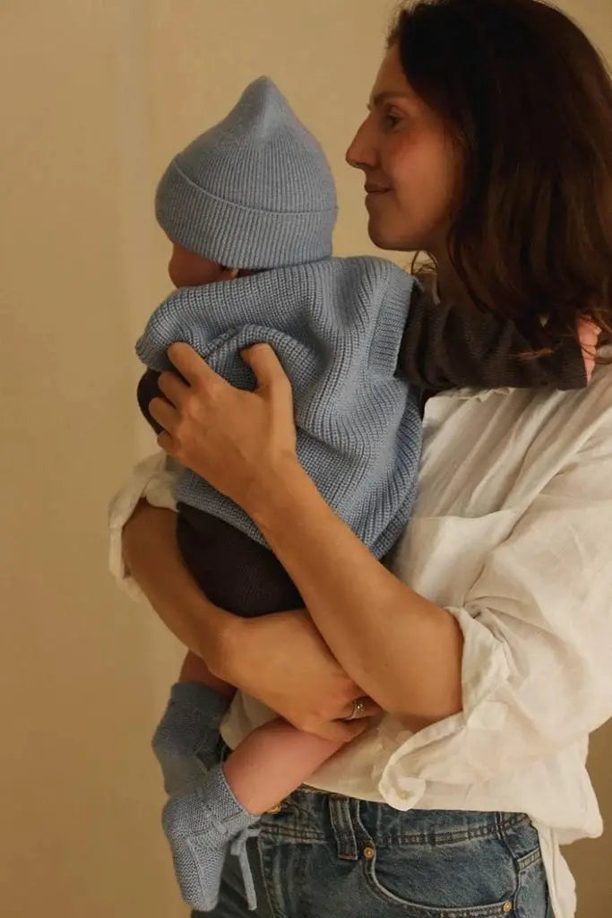 HVID newborn bonnet in sky blue knit with matching baby sweater