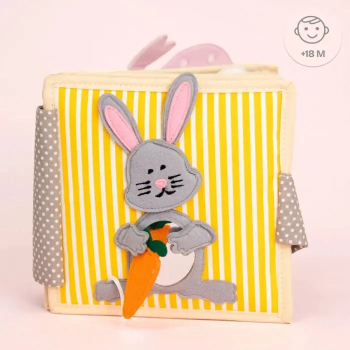 JOLLY DESIGNS livre d'éveil bébé par Citron Grenadine; bunny gris avec carotte sur rayures jaunes