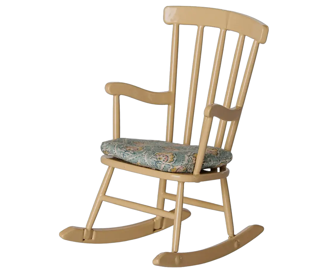 Dollhouse rocking chair in beige wood with a teal floral cushion.