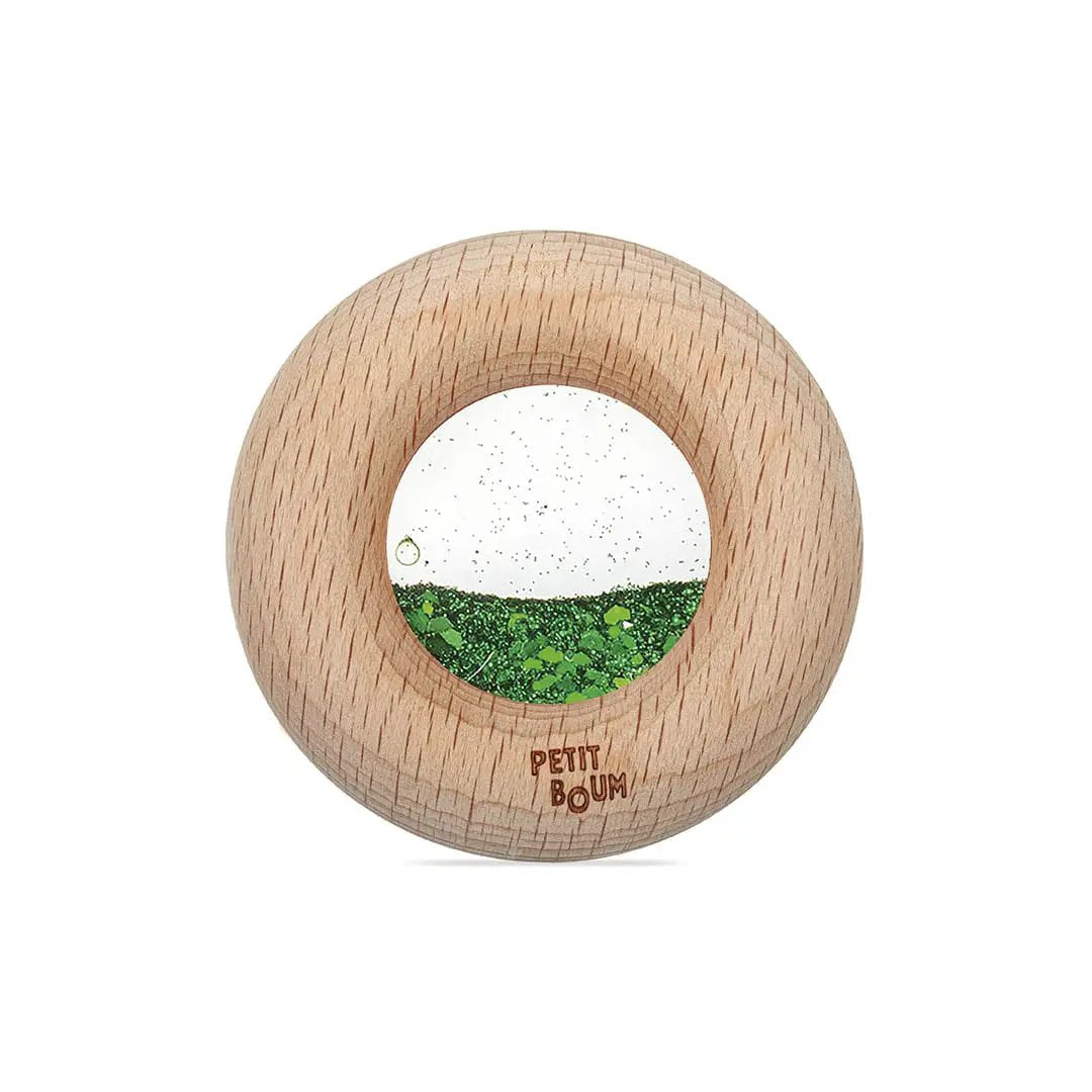 Petit Boum wooden donut sensory teething toy in green with glitter window