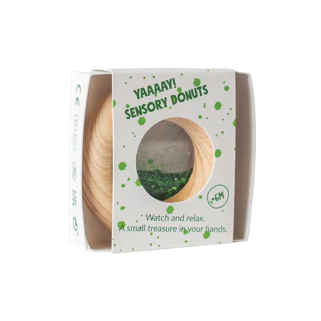 Petit Boum donut sensoriel green teething toy by Citron Grenadine, wooden donut design in box