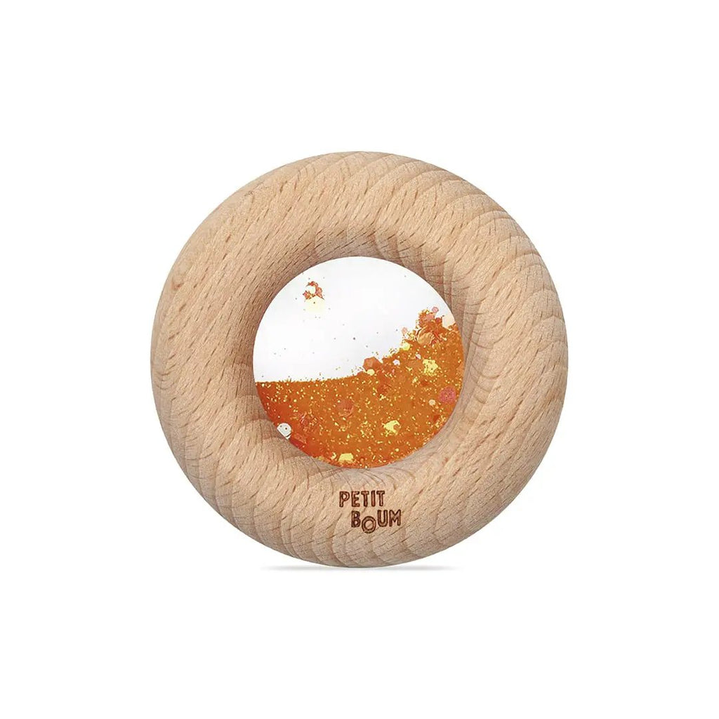 Donut sensoriel en bois orangeavec centre blanc à éclats orange, PETIT BOUM par Citron Grenadine, jouet de dentition
