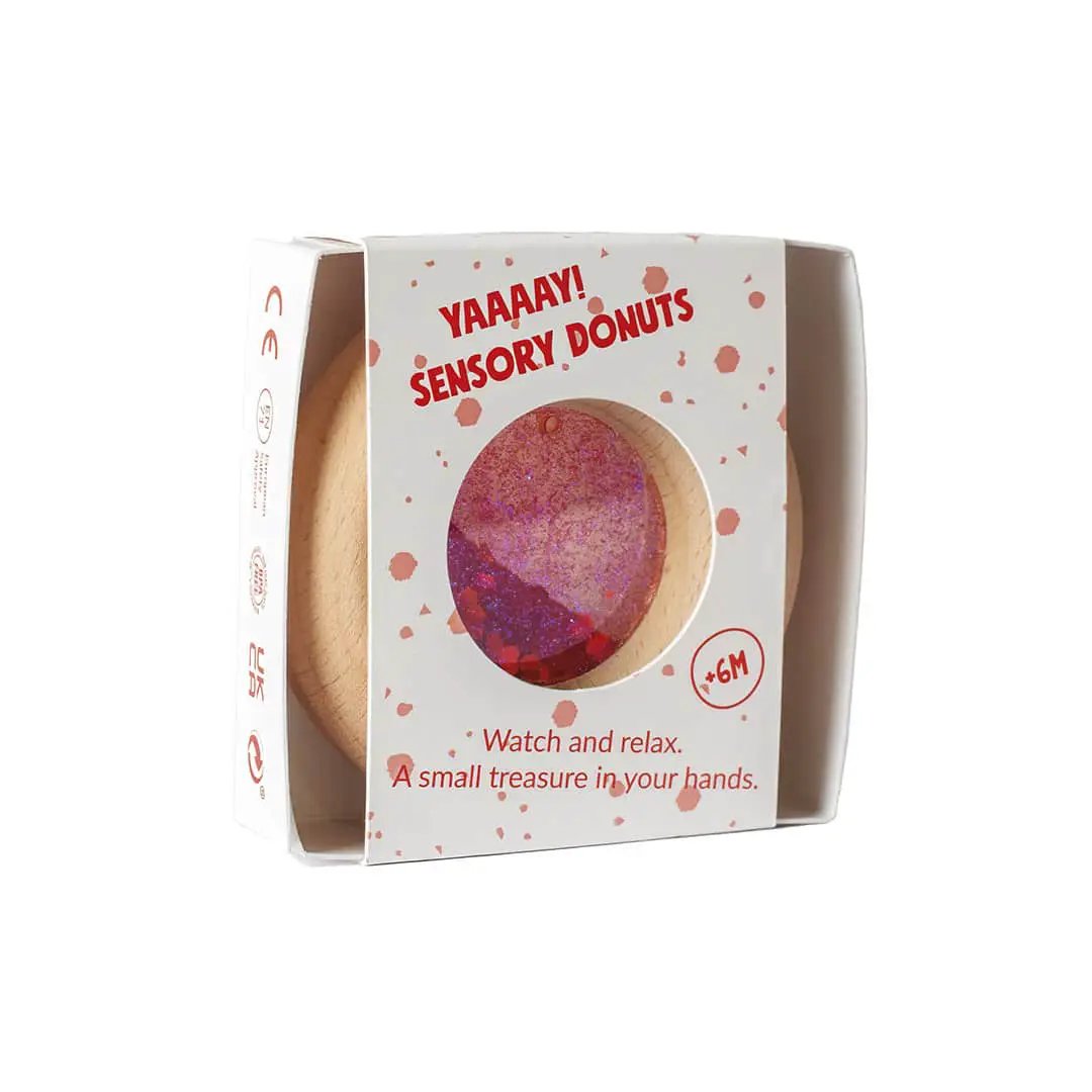 Petit Boum sensory donut teether red with glitter, packaged in a white box