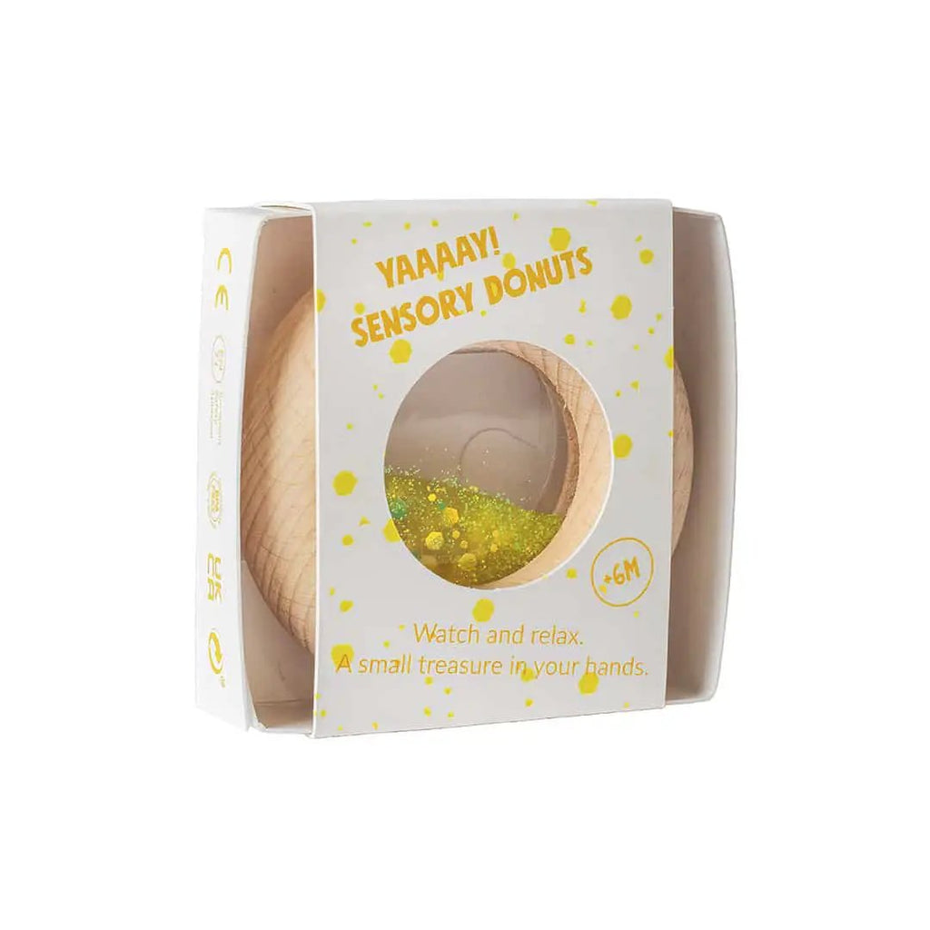 PETIT BOUM donut sensoriel yellow teething toy by Citron Grenadine in packaging