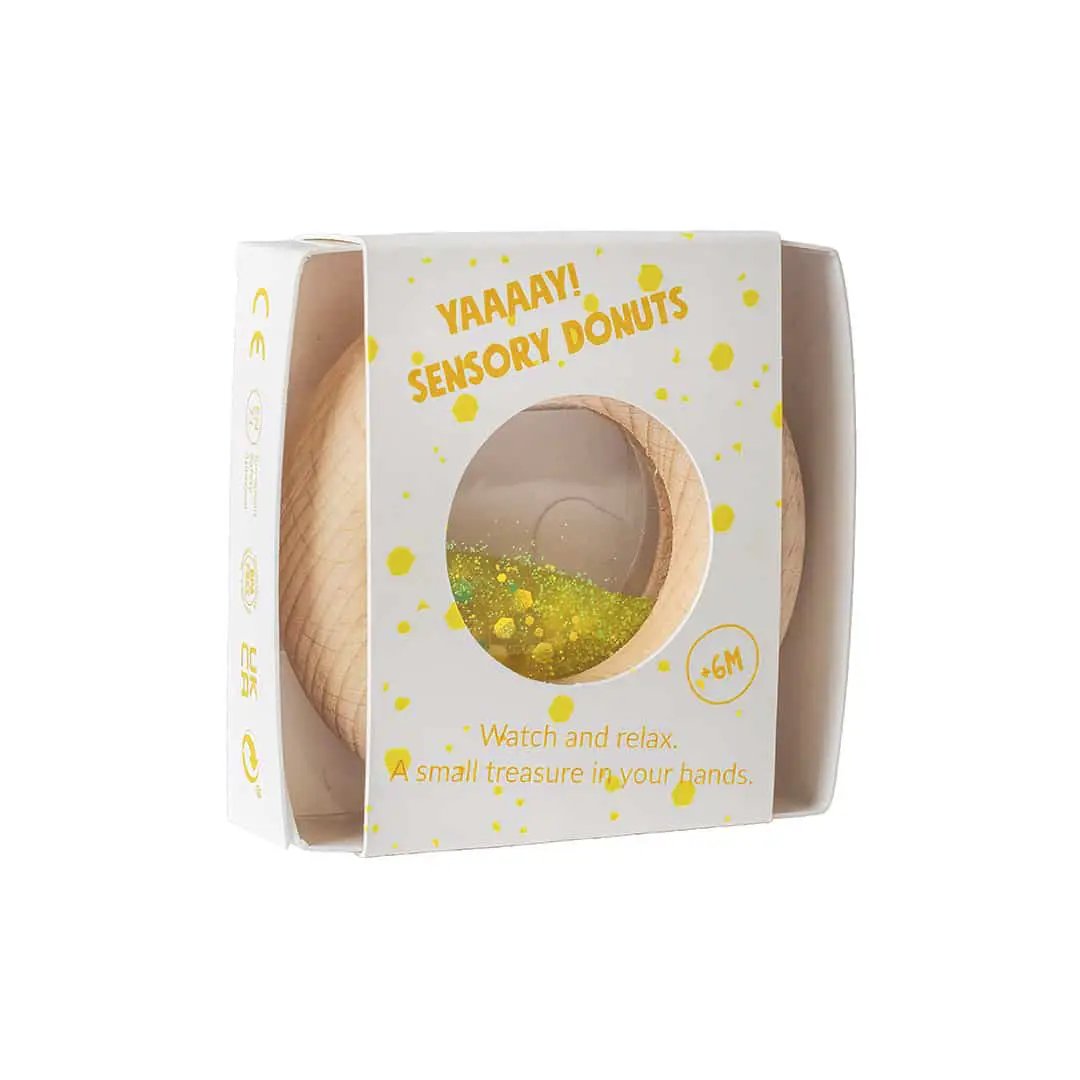 PETIT BOUM donut sensoriel yellow teething toy by Citron Grenadine in packaging