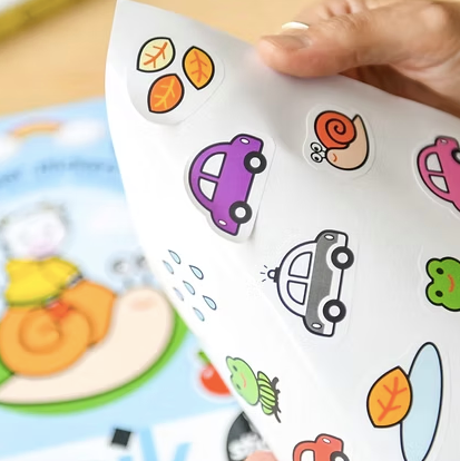 POPPIK sticker animaux sticker sheet by Citron Grenadine; colorful animal stickers for 18m+, held by hand.