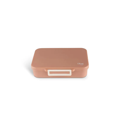 Citron Grenadine lunch box in blush pink with white latch.