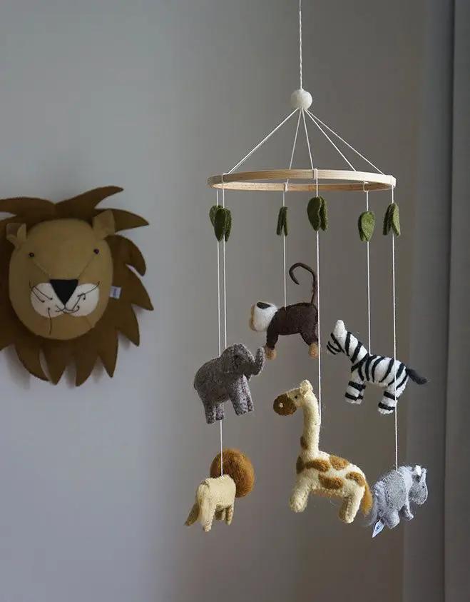 GAMCHA safari crib mobile with felt animal charms (elephant, giraffe, zebra, lion) on a wooden ring
