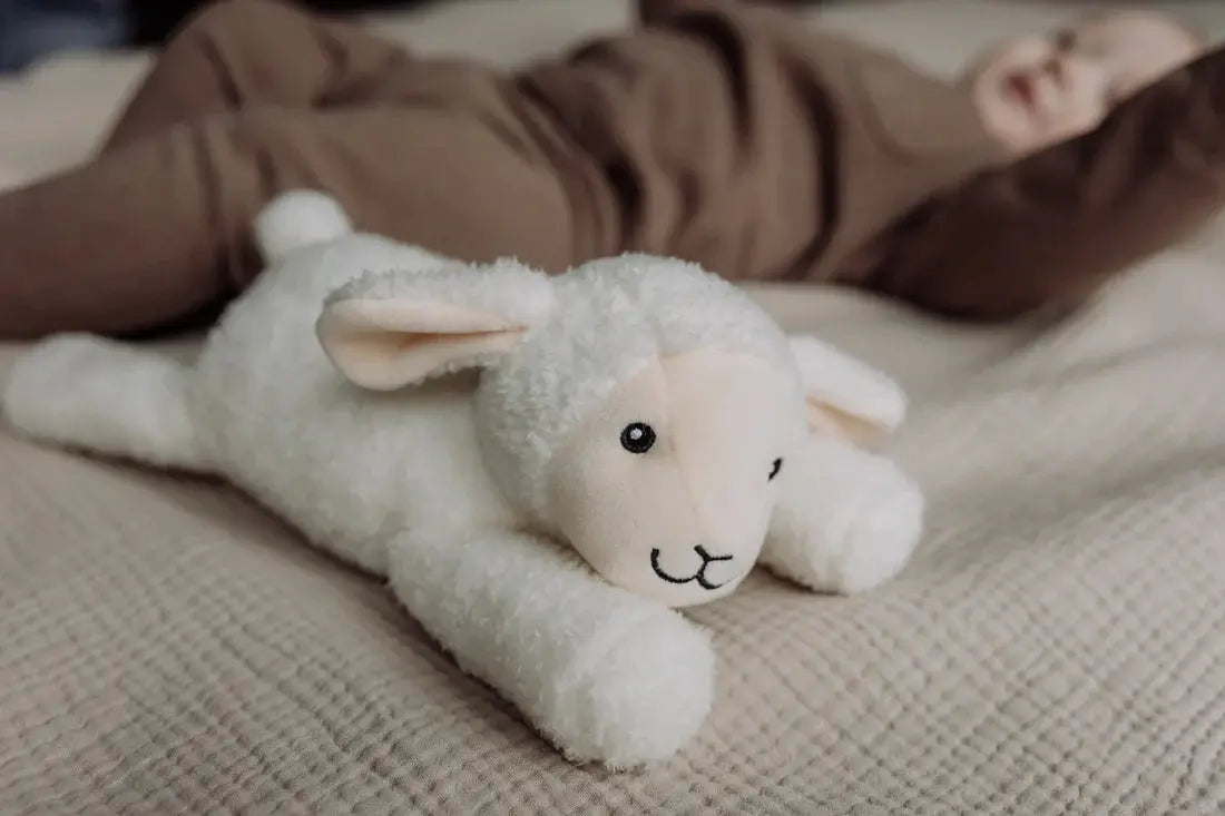 FLOW AMSTERDAM Rosie doudou musical toy with white plush lamb by Citron Grenadine, sound machine