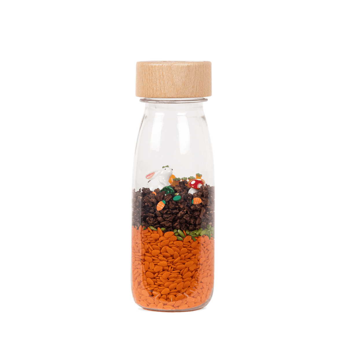 Bouteille sensorielle PETIT BOUM en verre avec bouchon en bois, décor lapin et carottes orange