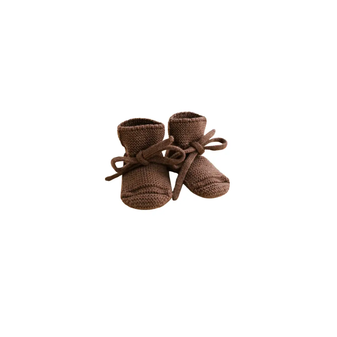 Pair of HVID knitted baby booties in mocha by Citron Grenadine