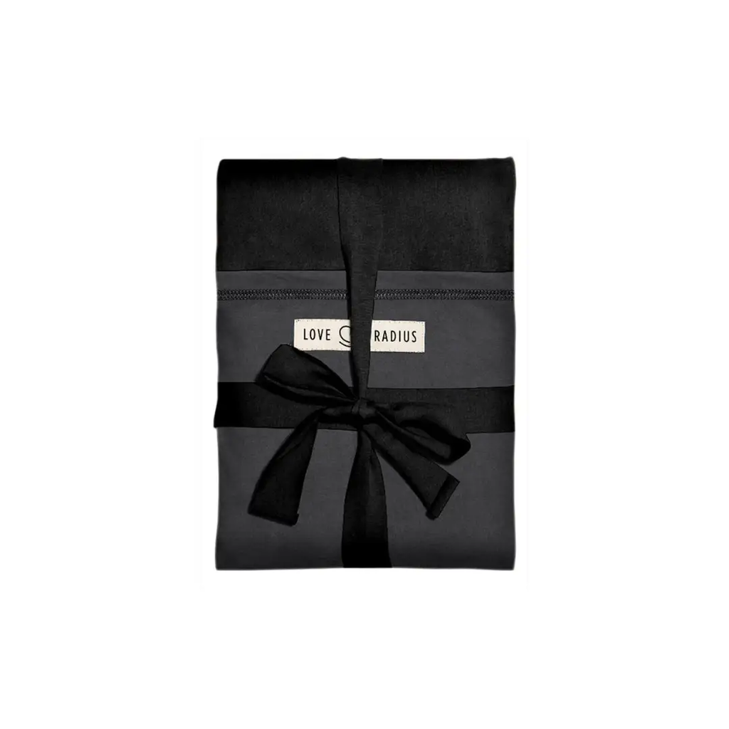 Love Radius JPMBB scarf, black, folded with a black ribbon and visible logo tag.