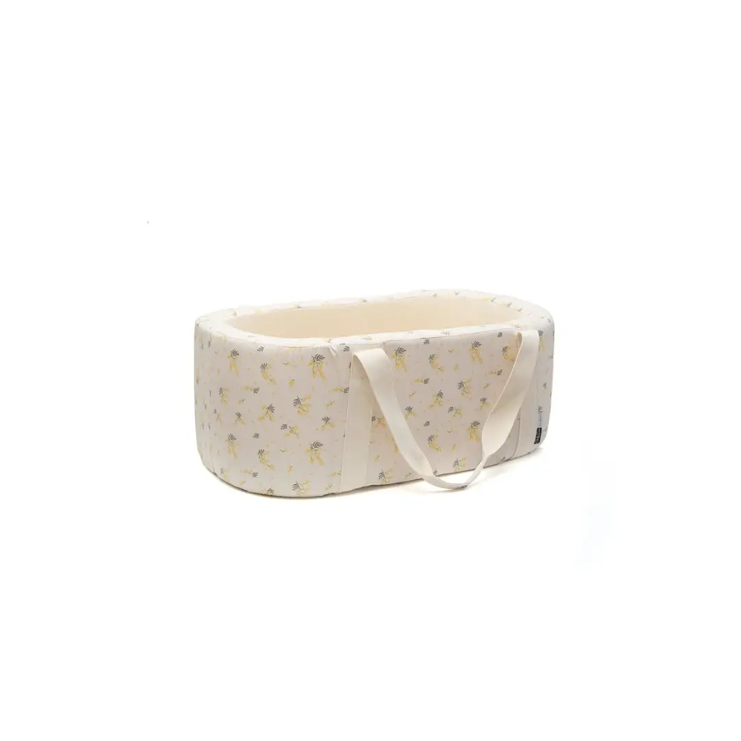 Charlie Crane couffin kuko mimosa baby bassinet in cream fabric with yellow floral pattern and carrying handles