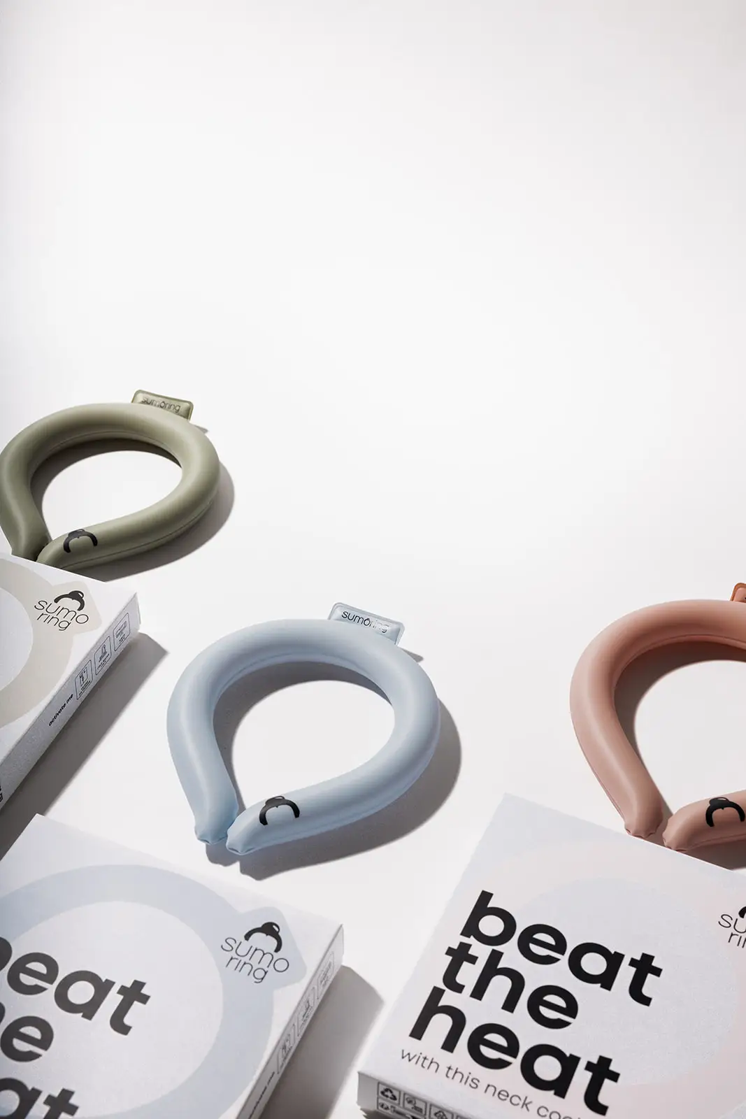 3-piece SUMORING cooling necklace set in sage green, pale blue and pink; Sumoring with beat the heat packaging.