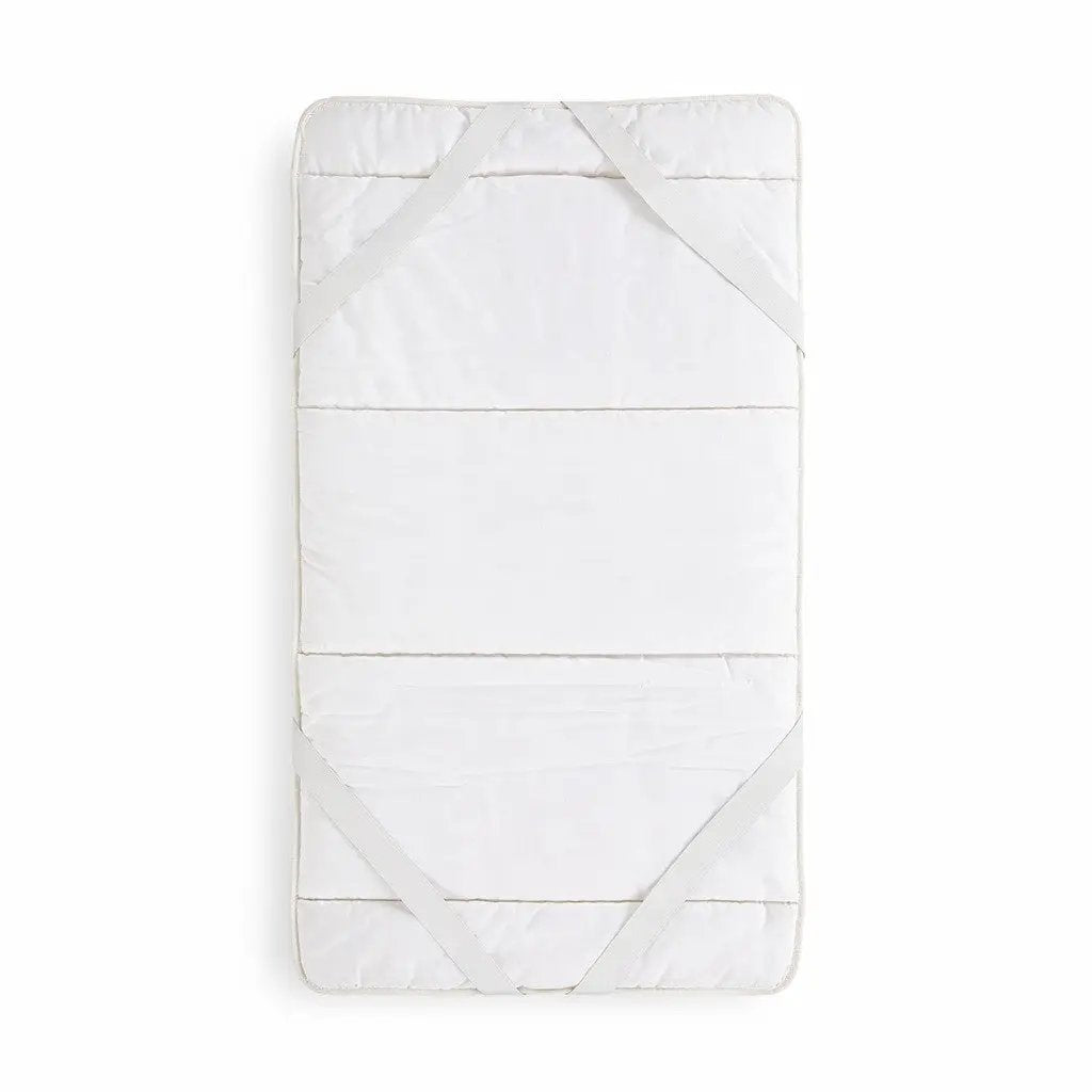 Surmatelas Coni laine et coton blanc avec sangles croisées de fixation