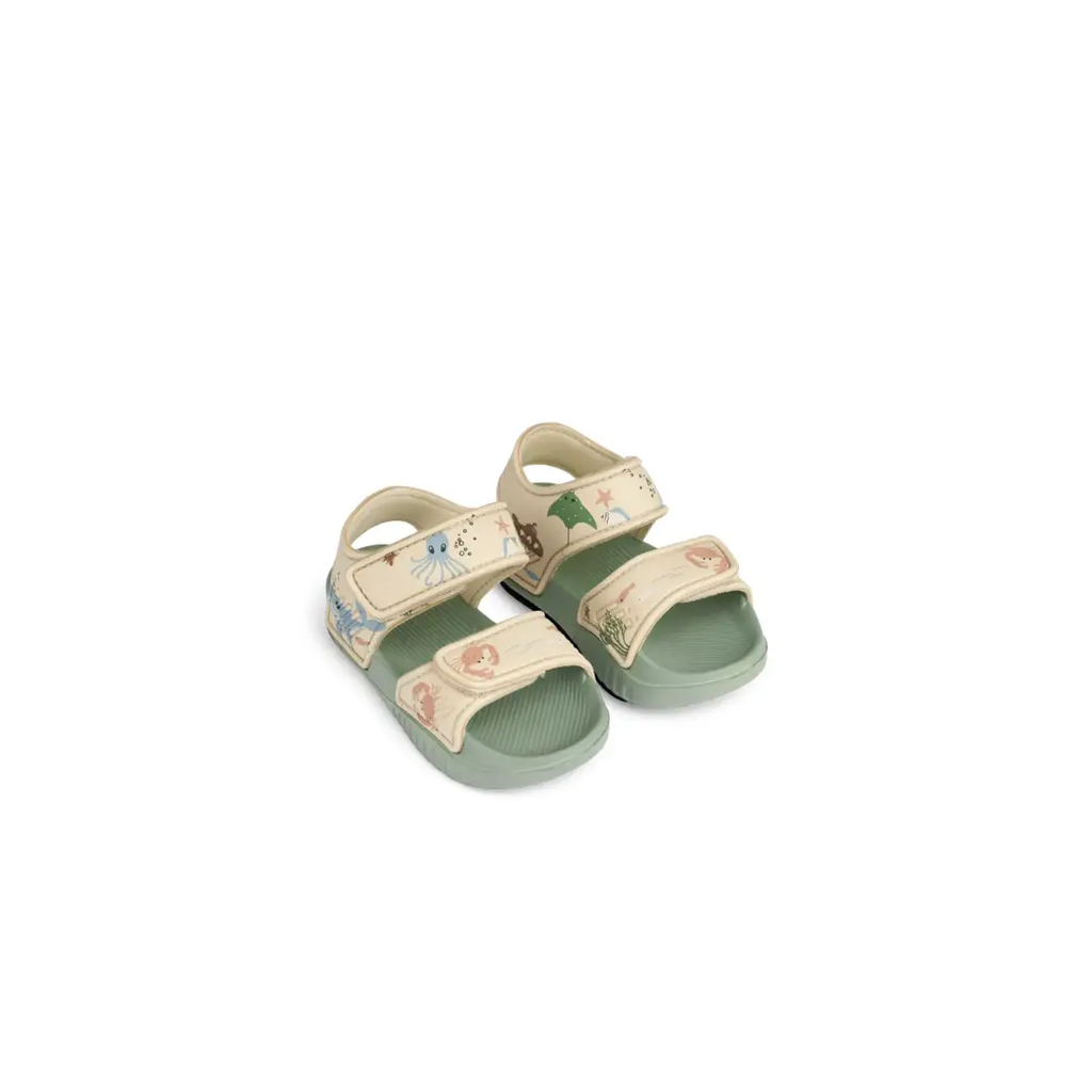 Citron Grenadine baby sandals with sea creature print; beige straps, green sole