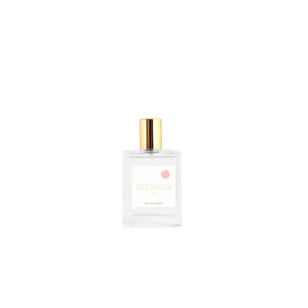MINOIS Eau de Toilette bottle by Citron Grenadine, clear glass with a gold cap and pale label.