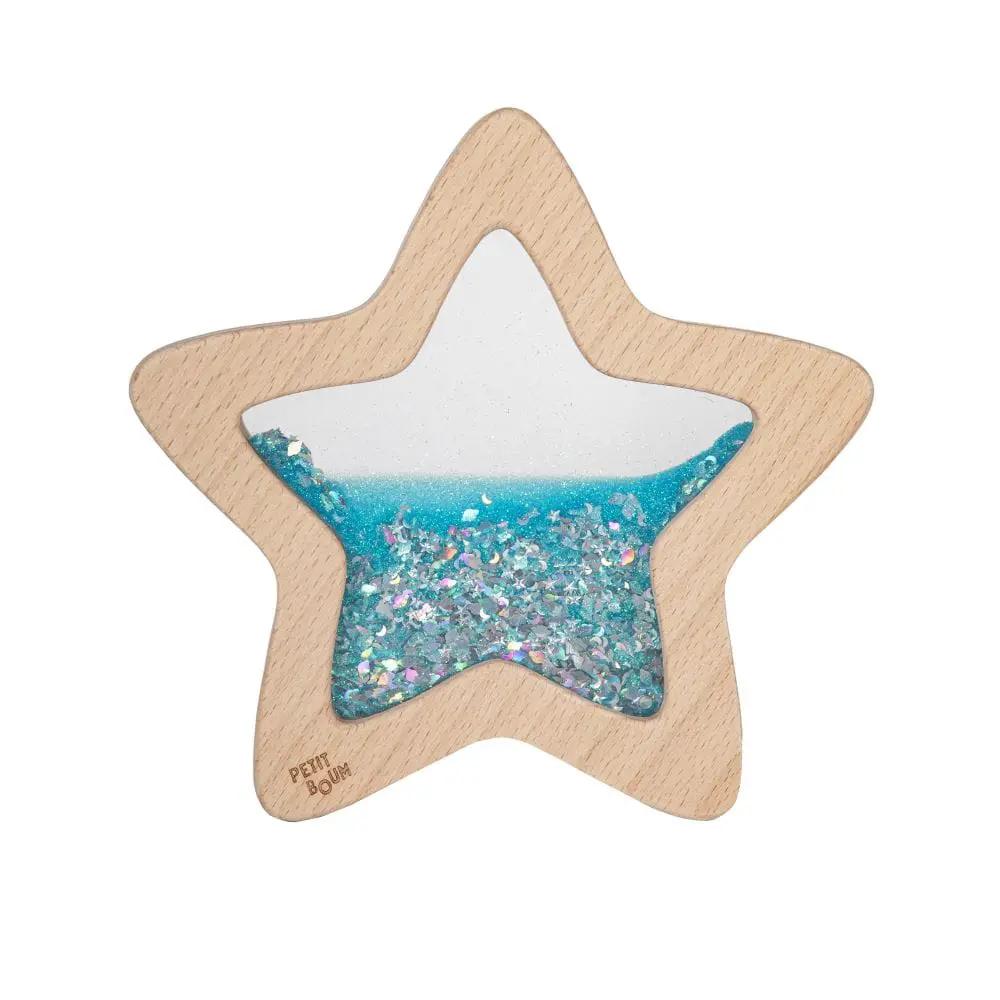 Star-shaped wooden sensory rattle with blue glitter-filled center by Petit Boum