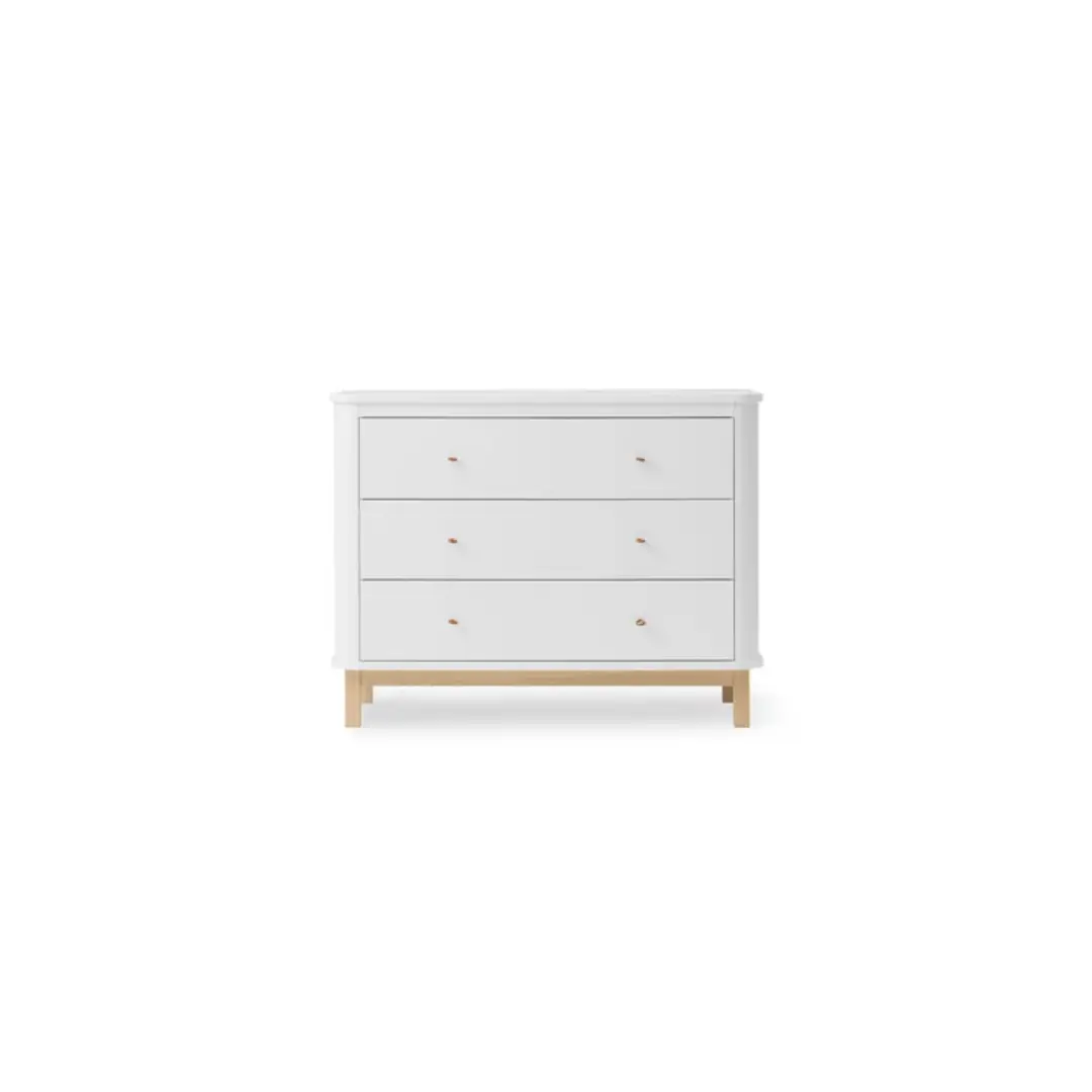 Dresser with white finish, three drawers, and natural oak legs.