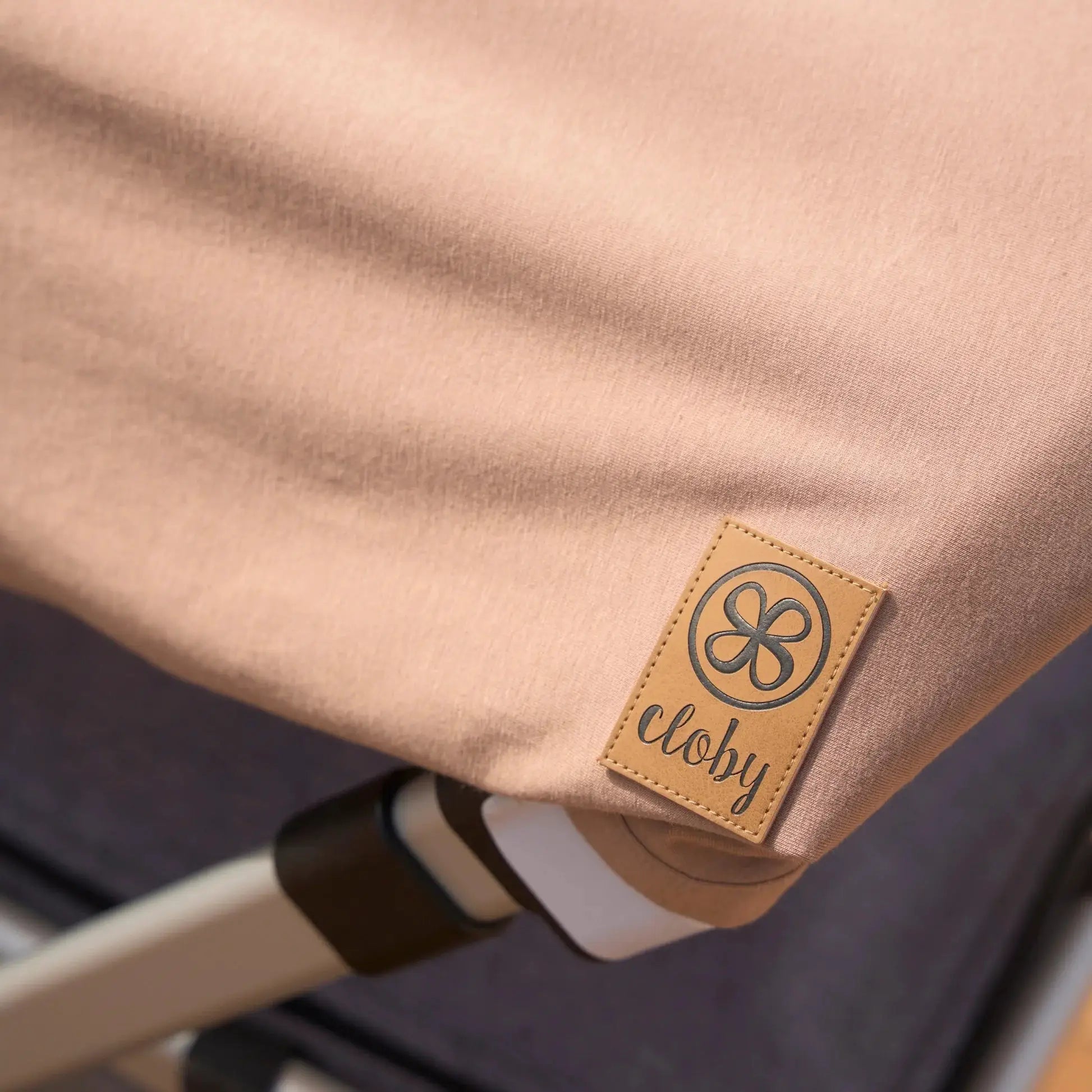 Cloby baby carrier cover in misty rose fabric with UPF 50+ sun protection