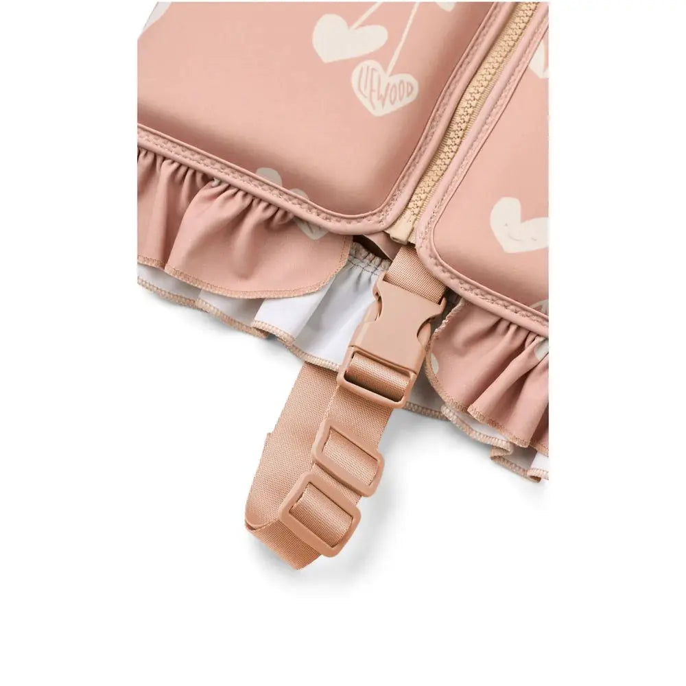 LIEWOOD dove swim vest in pale pink with ruffle hem, zipper and adjustable buckle strap