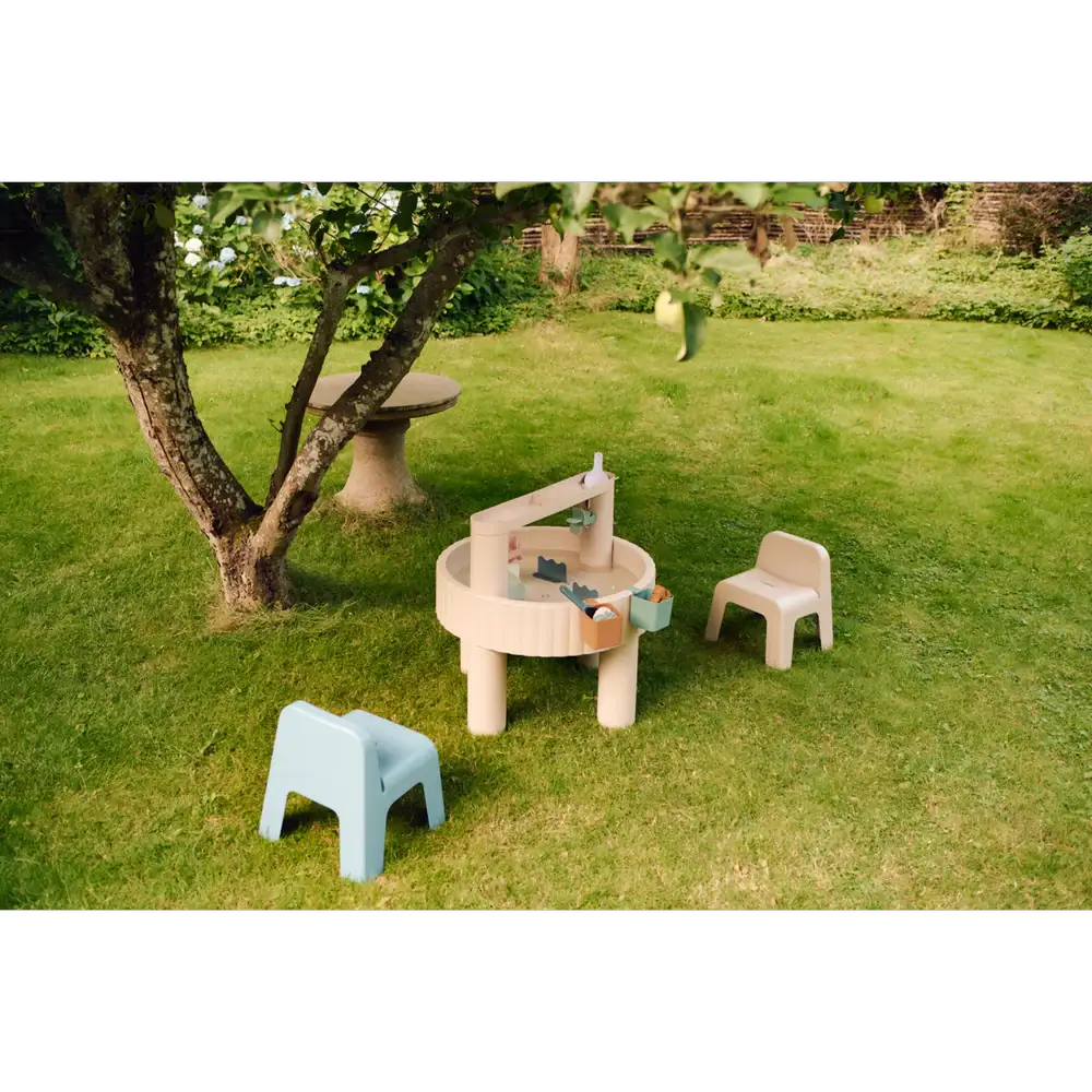 LIEWOOD Sepp activity table on lawn with 2 pastel chairs and sand-play accessories