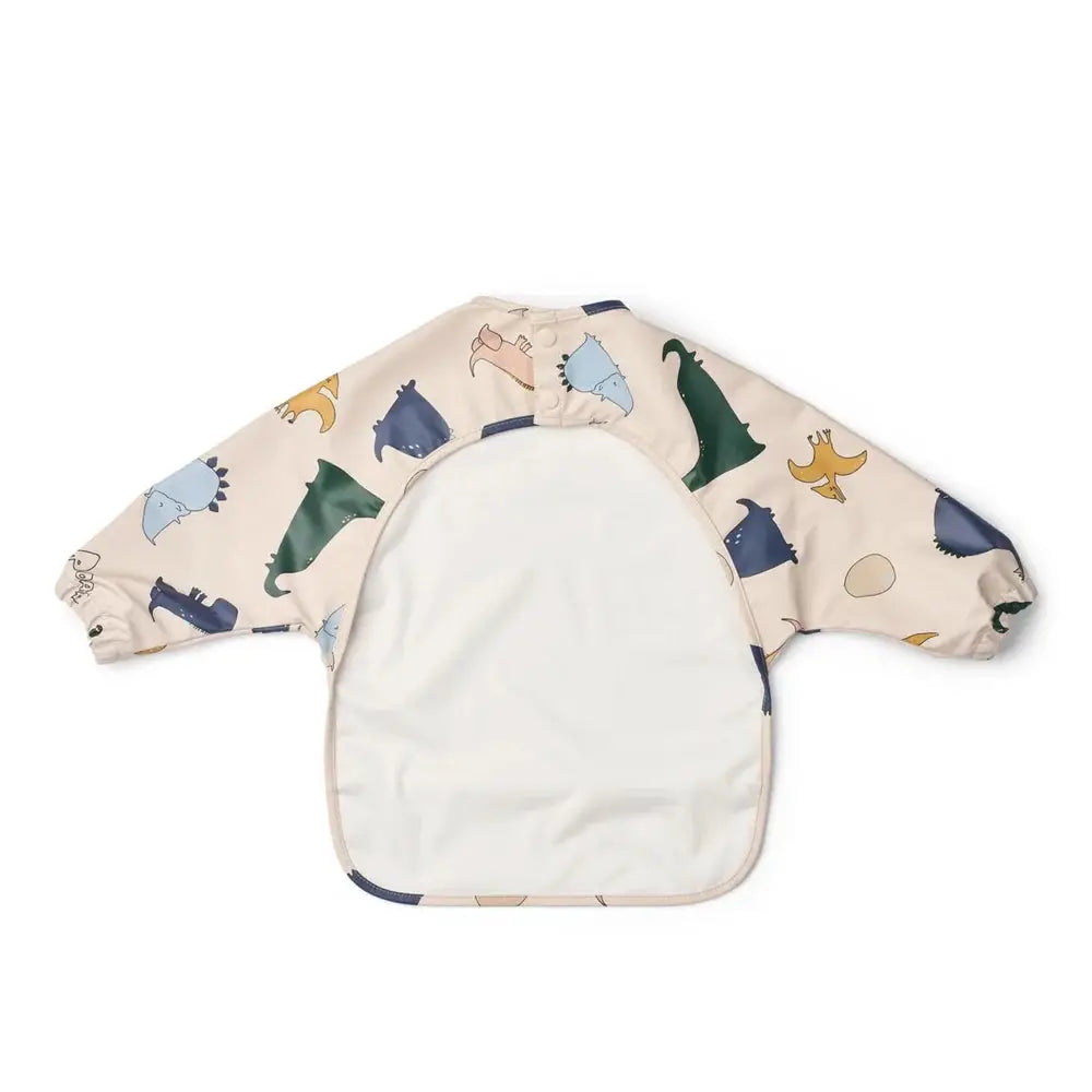 LIEWOOD bavoir Merle dino roar sandy long-sleeve bib with beige base and dinosaur print