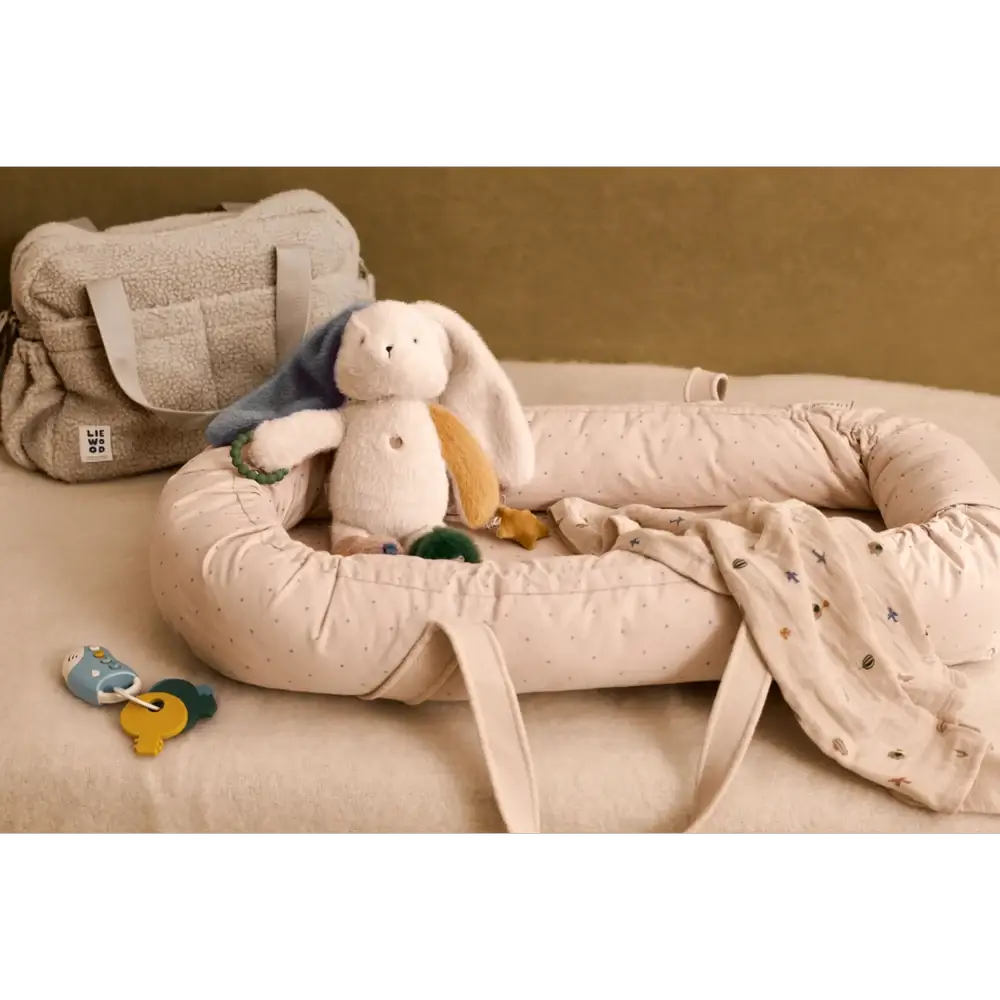 LIEWOOD Angelina activity bunny 3m+ baby toy with plush cream rabbit in a padded cream nest lounger and soft textures