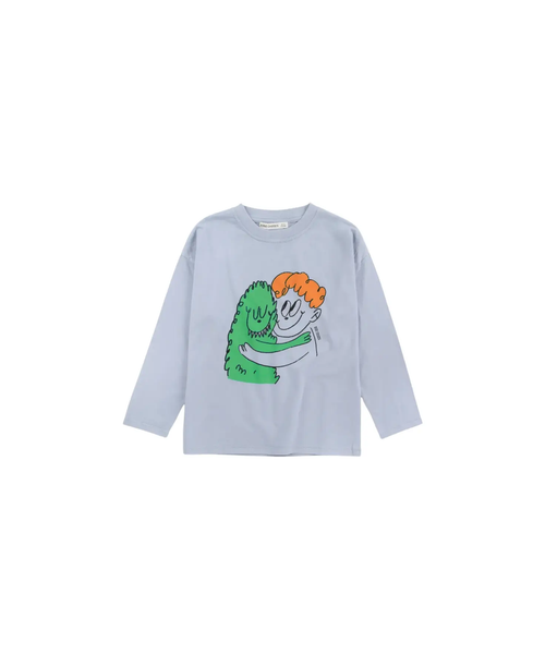 BOBO CHOSES hug hairy monster sweatshirt on light blue fabric with a green monster embracing an orange-haired character