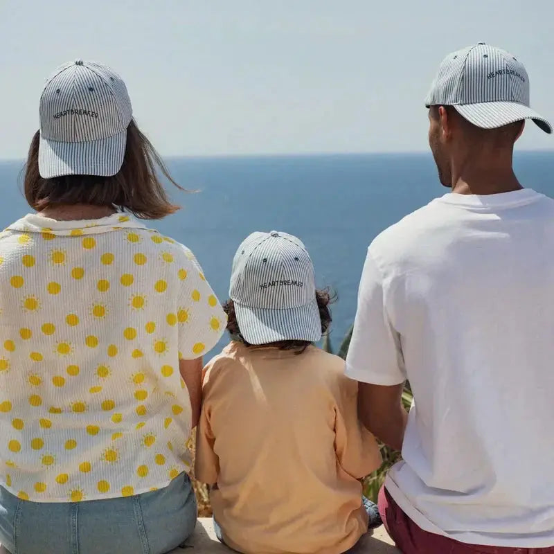 CHAMAYE casquette marinière Heartbreaker baseball cap by Citron Grenadine; blue-white striped cap worn by three.