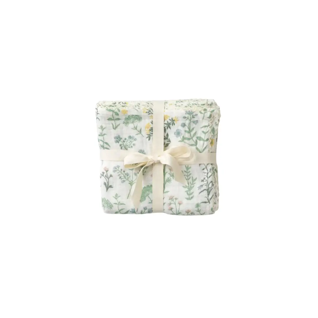Set of 3 bibs in a soft summer flowers print, tied with a cream ribbon bow.