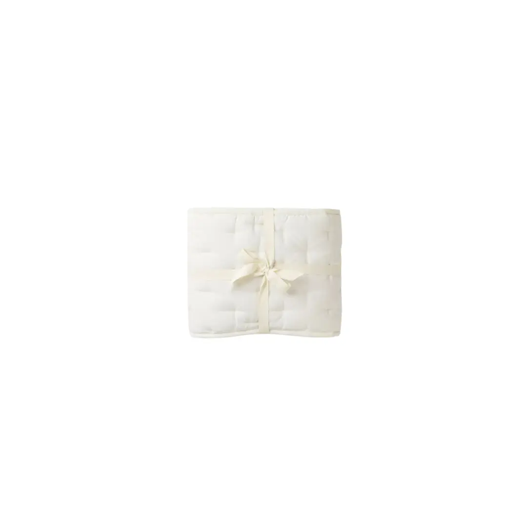 Tour de lit crib liner by Citron Grenadine, white quilted with cream ribbon bow