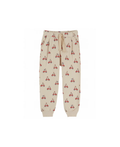 EMILE ET IDA jogger pants by Citron Grenadine; beige fabric with red dog-on-scooter print, ribbed cuffs