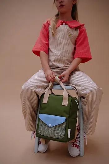 Citron Grenadine school backpack in green with blue front pocket and beige straps.