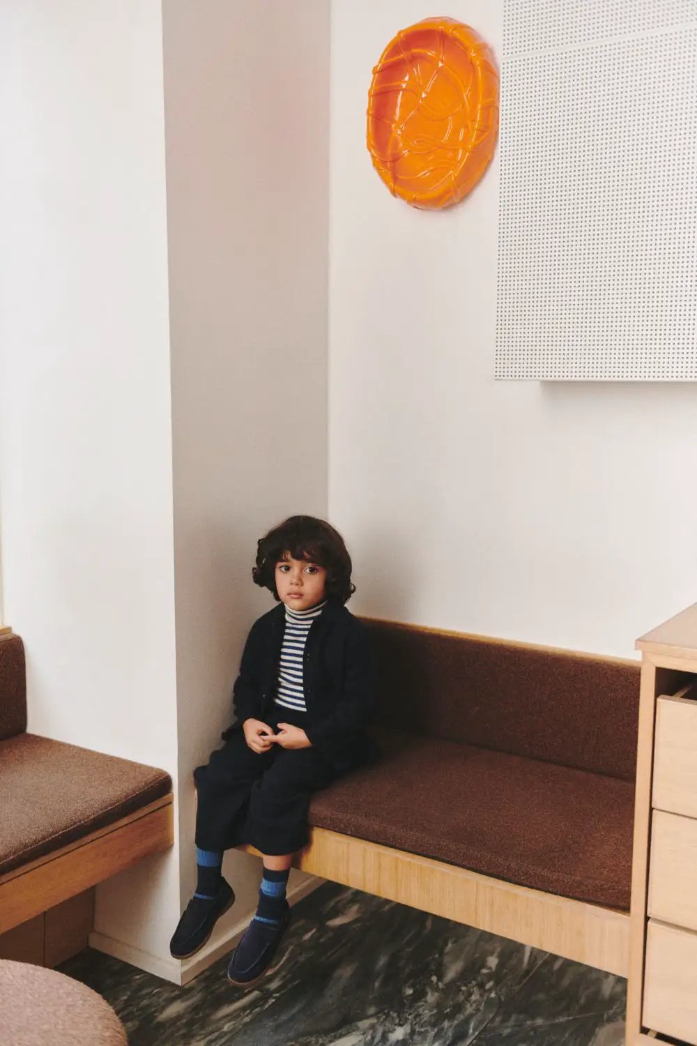 FUB pull col roulé en merinos for kids, ecru-deep indigo, child seated on bench in navy outfit