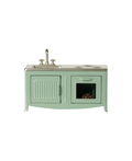 Cuisinière miniature vert menthe en métal avec évier et robinet, portes et four visibles